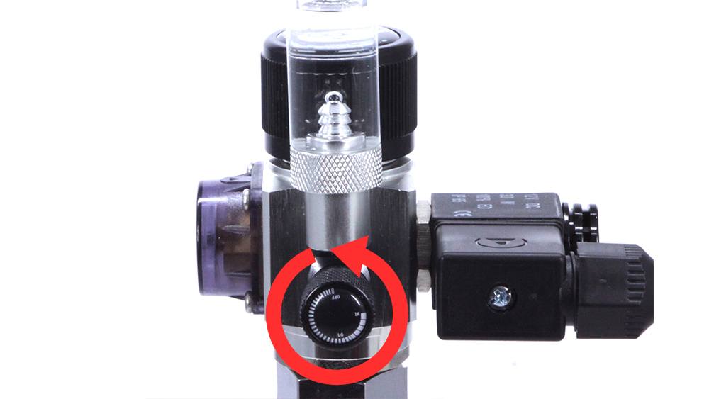 Open needle valve to determine dosing